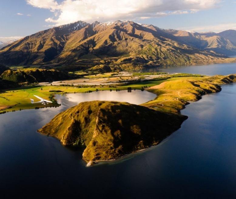 mountain-flying-over-paddock-bay-lake-wanaka